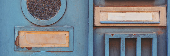 Letterboxes on a blue door