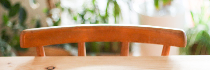 Wooden chair tucked under wooden table